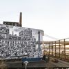 JR Unveils Giant "Chronicles of New York" Mural On Shipping Containers In Domino Park